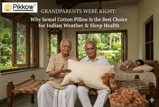 Elderly Indian grandparents holding a traditional semal cotton pillow inside a natural home, showcasing breathable, eco-friendly bedding ideal for Indian weather and healthy sleep.